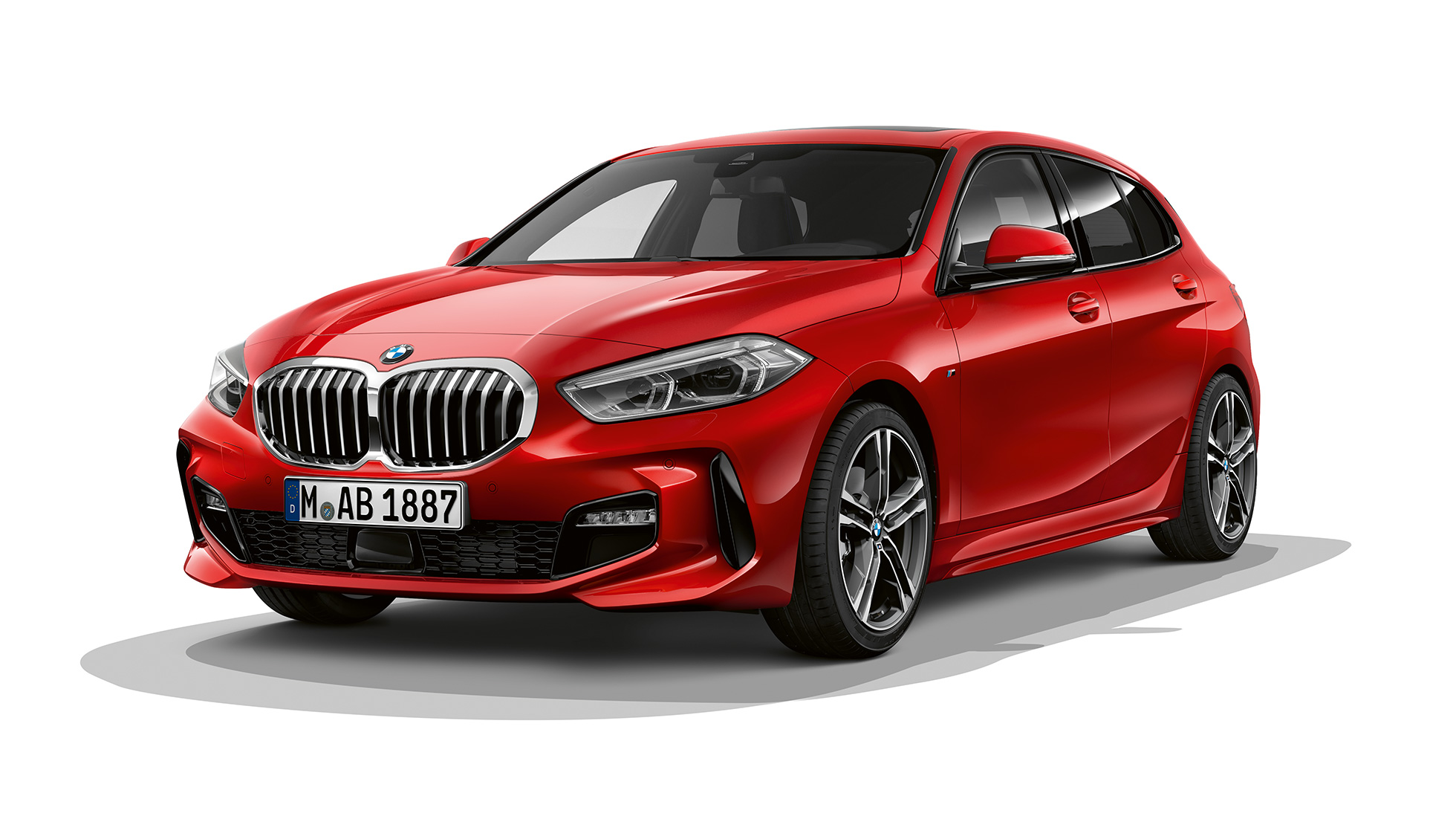 BMW 1 Series Model M Sport, three-quarter rear. BMW 1 Series Model M Sport in Melbourne Red metallic, studio shot three-quarter rear.